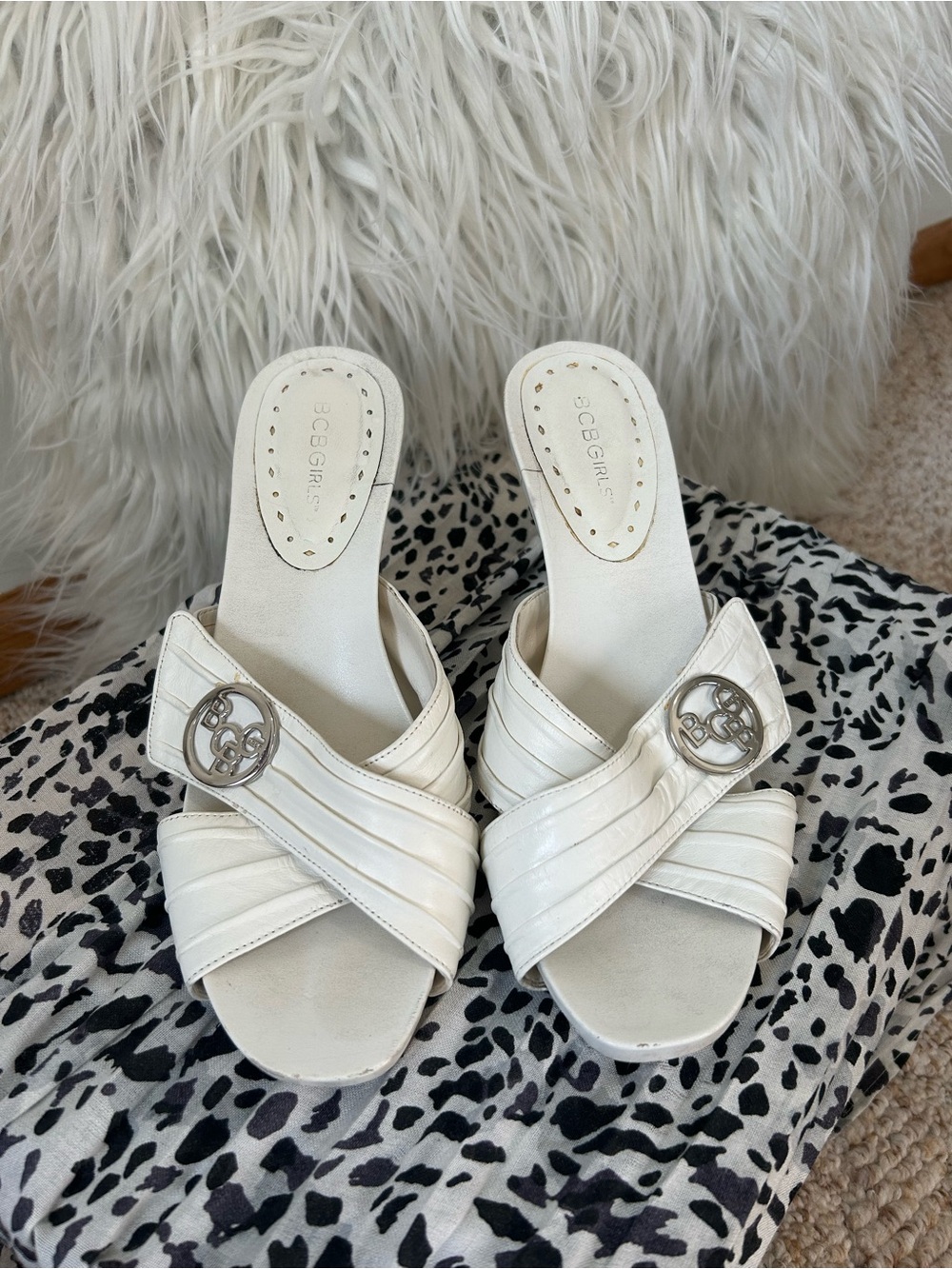 BCBGirls White Leather Slip-On Mules with Silver Logo Buckles